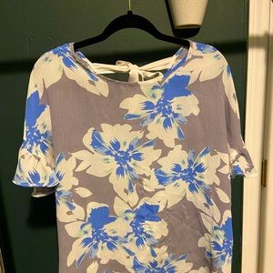 Simply Styled Grey Blouse with Blue and White Flower Accents Design